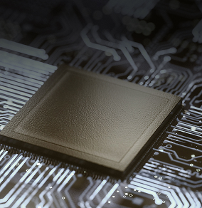 Close-up of a black microchip on a circuit board with illuminated pathways.